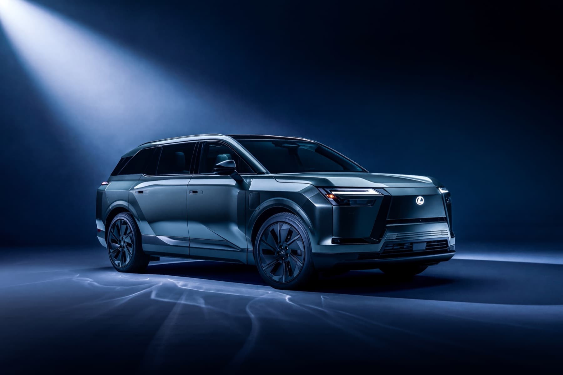 2027 Lexus TZ electric three-row SUV in a studio, front three-quarter view