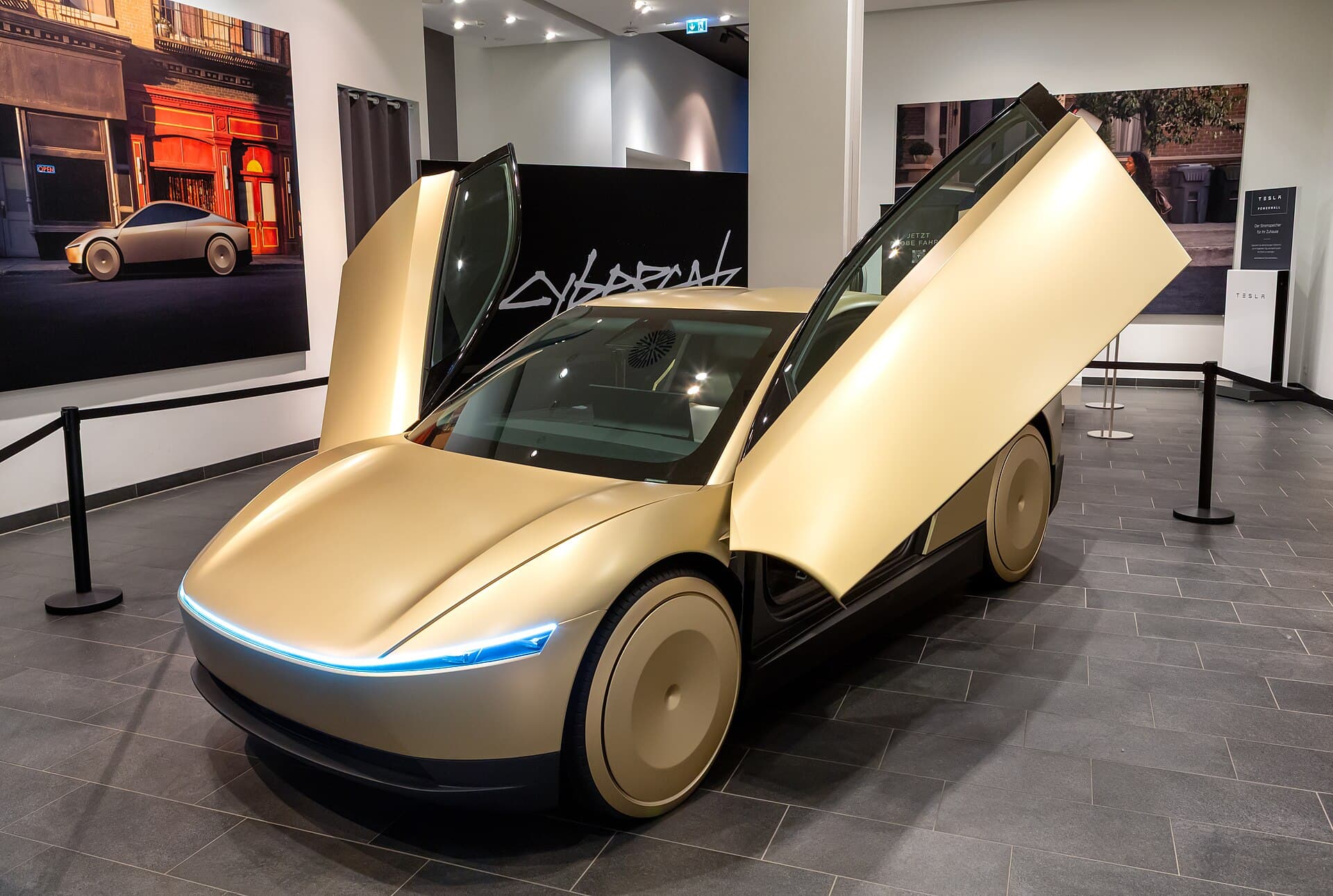 Gold Tesla Cybercab two-seat robotaxi on display at the Mall of Berlin in 2024