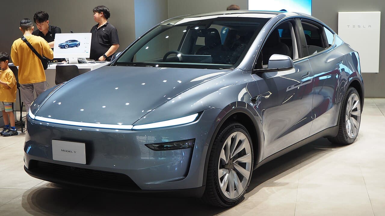 2025 Tesla Model Y Long Range all-wheel drive in a showroom