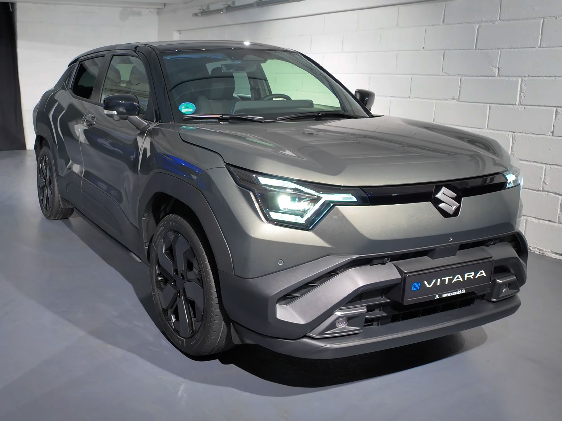 Suzuki e Vitara electric crossover at front three-quarter angle