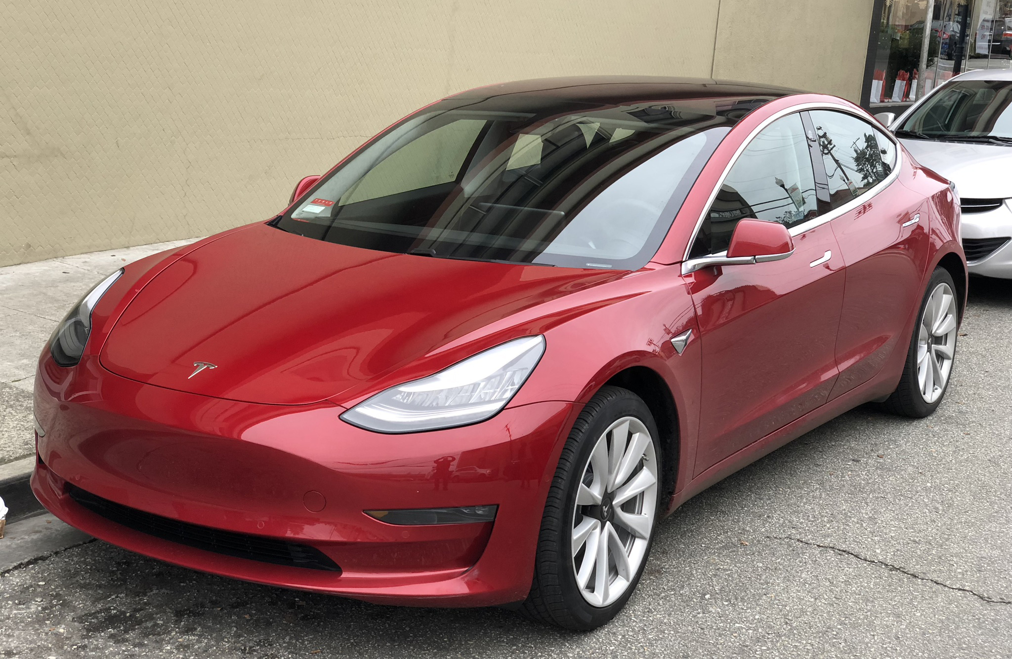 Tesla Model 3 front driver-side view showing flush door handle area