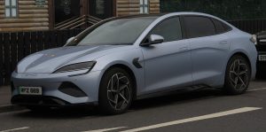 2025 BYD Seal sedan in Shark Grey, front three-quarter, photographed in Portrush, Northern Ireland — an export-market BYD already listed on GetEVCar