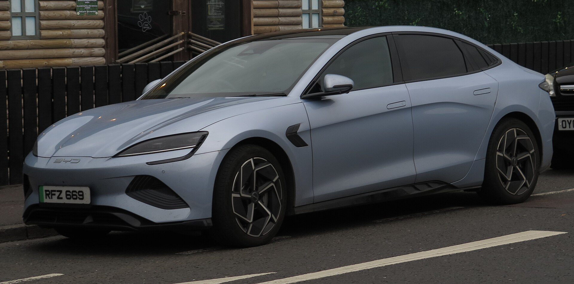 2025 BYD Seal sedan in Shark Grey, front three-quarter, photographed in Portrush, Northern Ireland — an export-market BYD already listed on GetEVCar