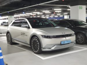 Gravity Gold Matte Hyundai Ioniq 5 electric SUV, three-quarter front view