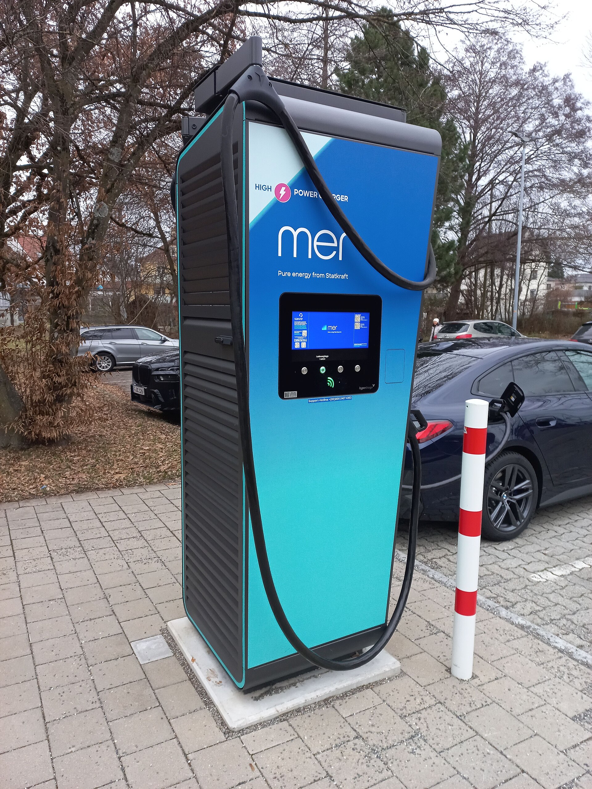 CCS Combo 2 DC hypercharger cabinet and cable at a European public charging site