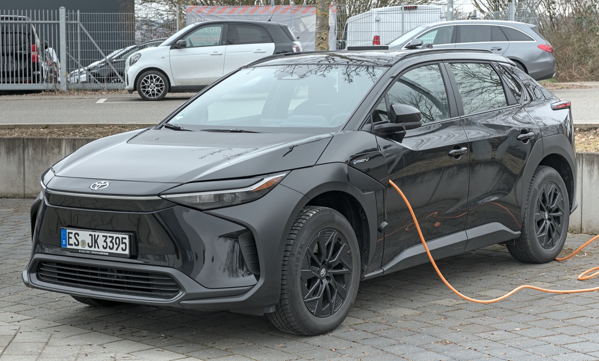 Toyota bZ4X electric SUV parked on a suburban street in Filderstadt, Germany.
