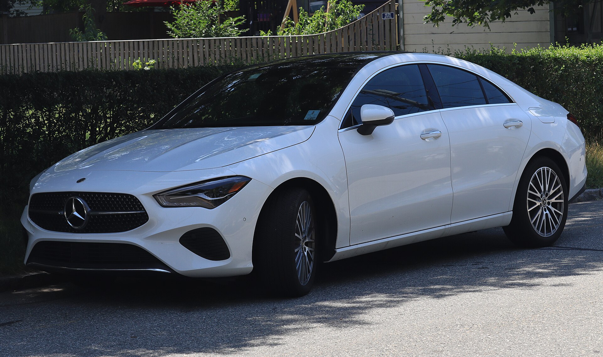 2025 Mercedes-Benz CLA 250 4MATIC sedan in Polar White, front three-quarter, photographed in Newport, Rhode Island — the generation the AMG CLA 45 is built on