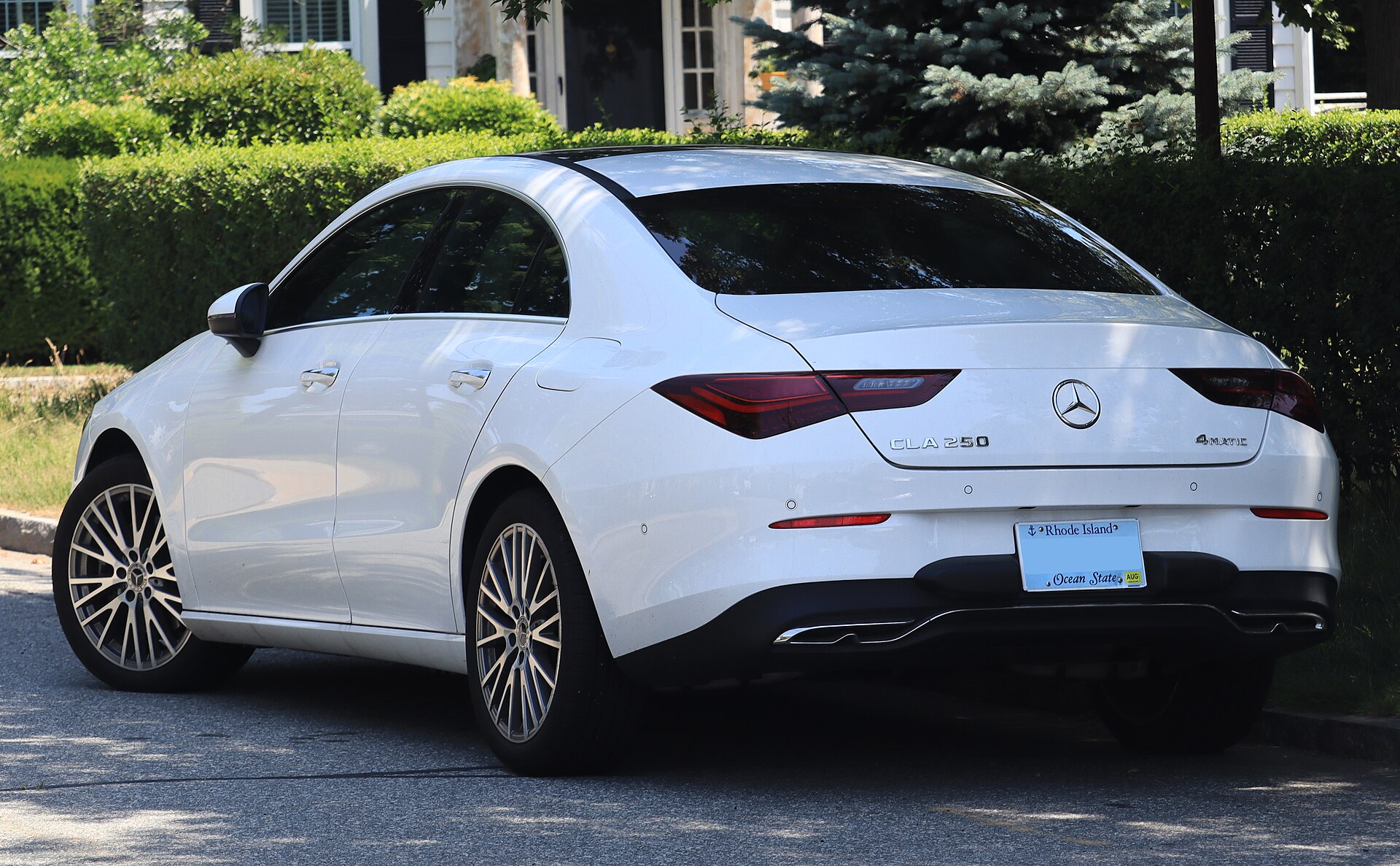2025 Mercedes-Benz CLA 250 4MATIC sedan in Polar White, rear three-quarter, photographed in Newport, Rhode Island