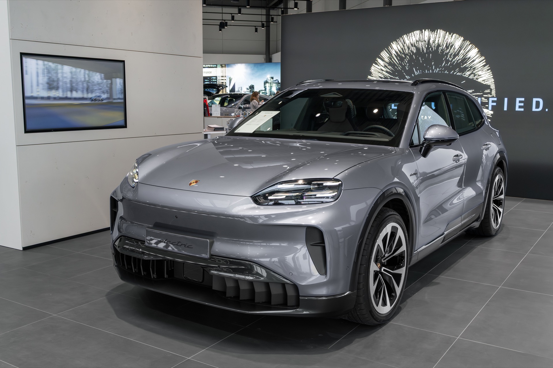 Vanadium Grey Porsche Cayenne Electric, front three-quarter view