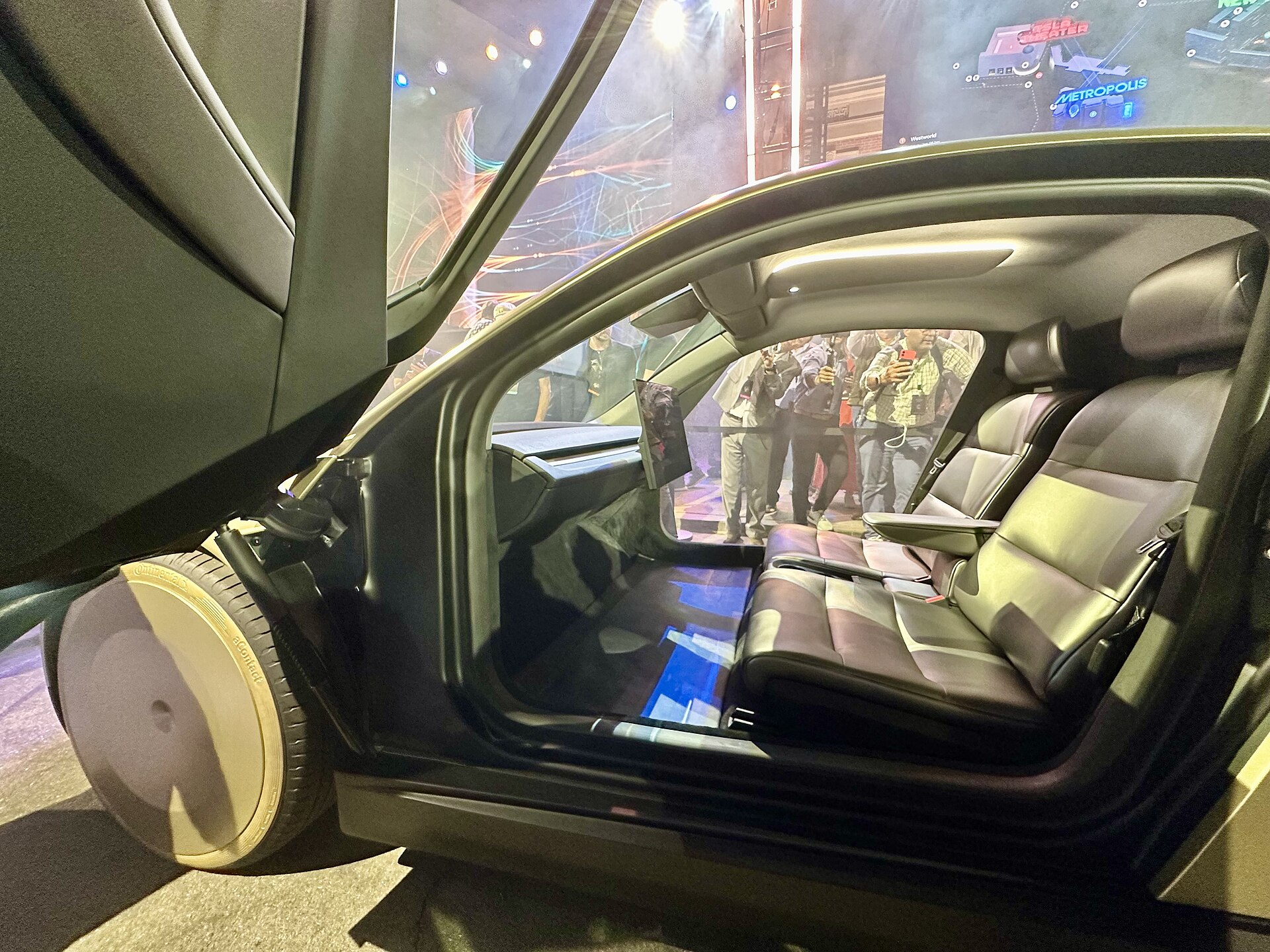 Tesla Cybercab cabin with no steering wheel or pedals, two seats and a large center screen