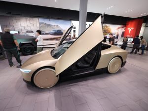 Tesla Cybercab three-quarter view at Santana Row, no conventional grille