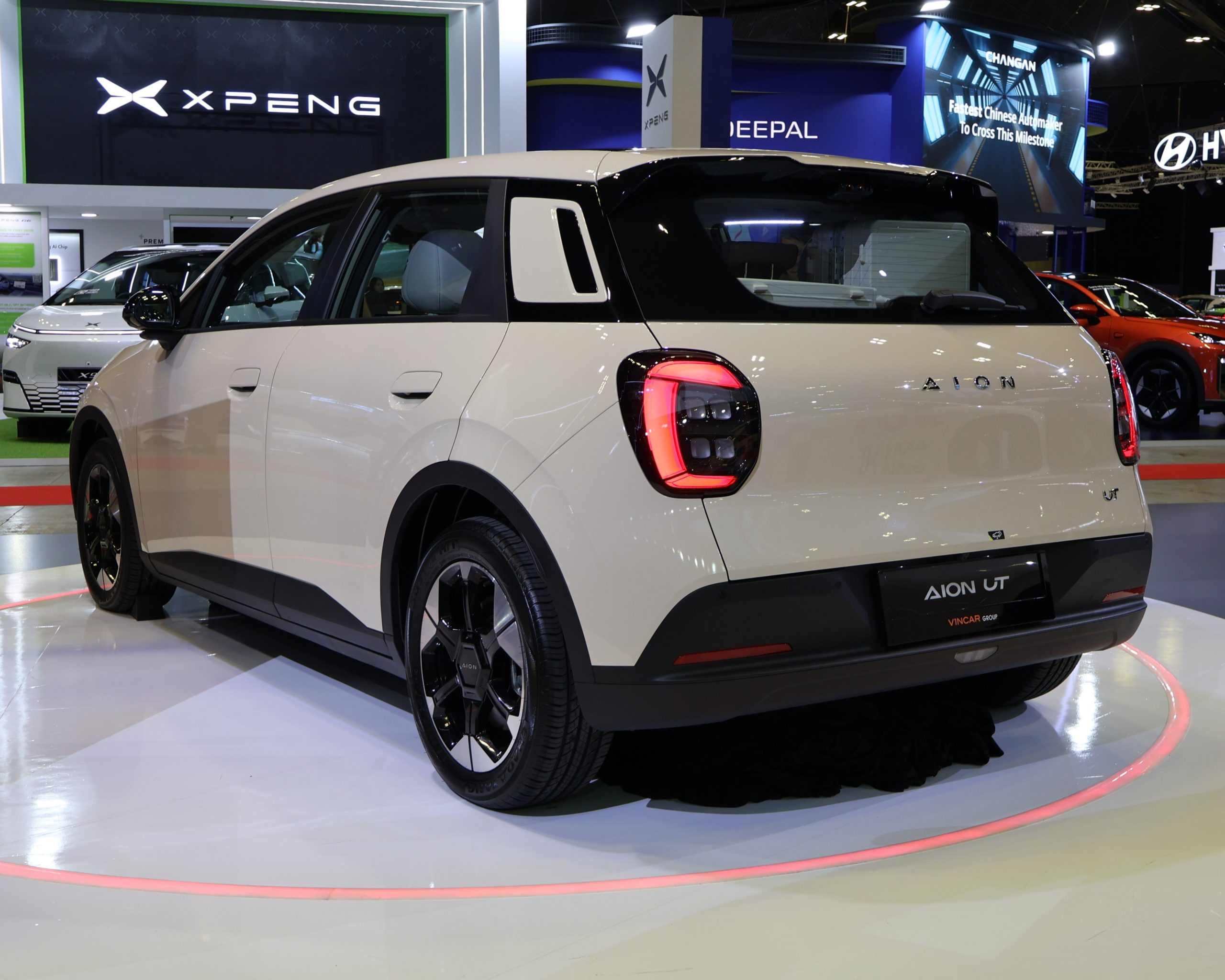 Rear view of the AION UT electric hatchback on a motor show stand