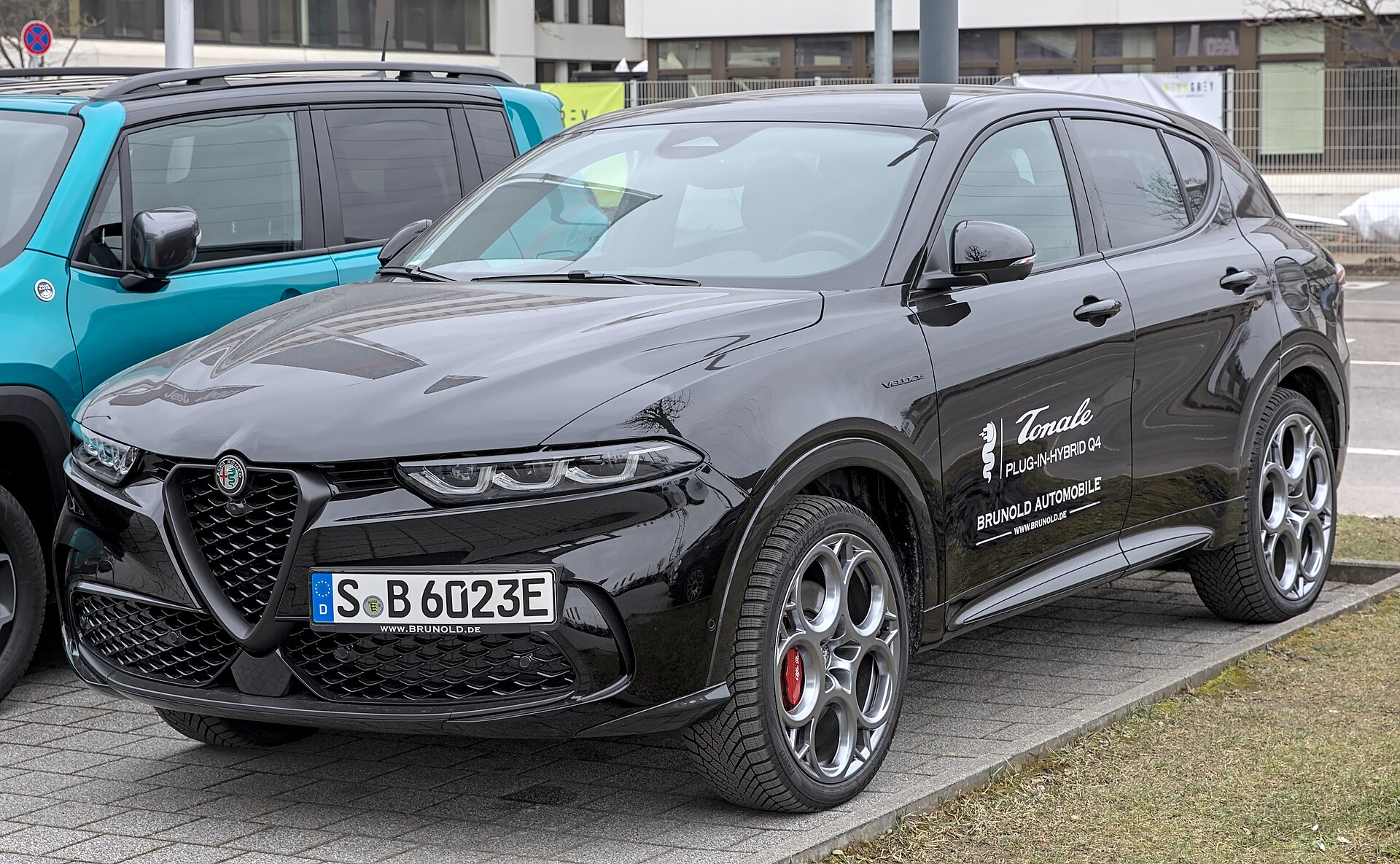 Black Alfa Romeo Tonale plug-in hybrid SUV, front three-quarter view on a Stuttgart street