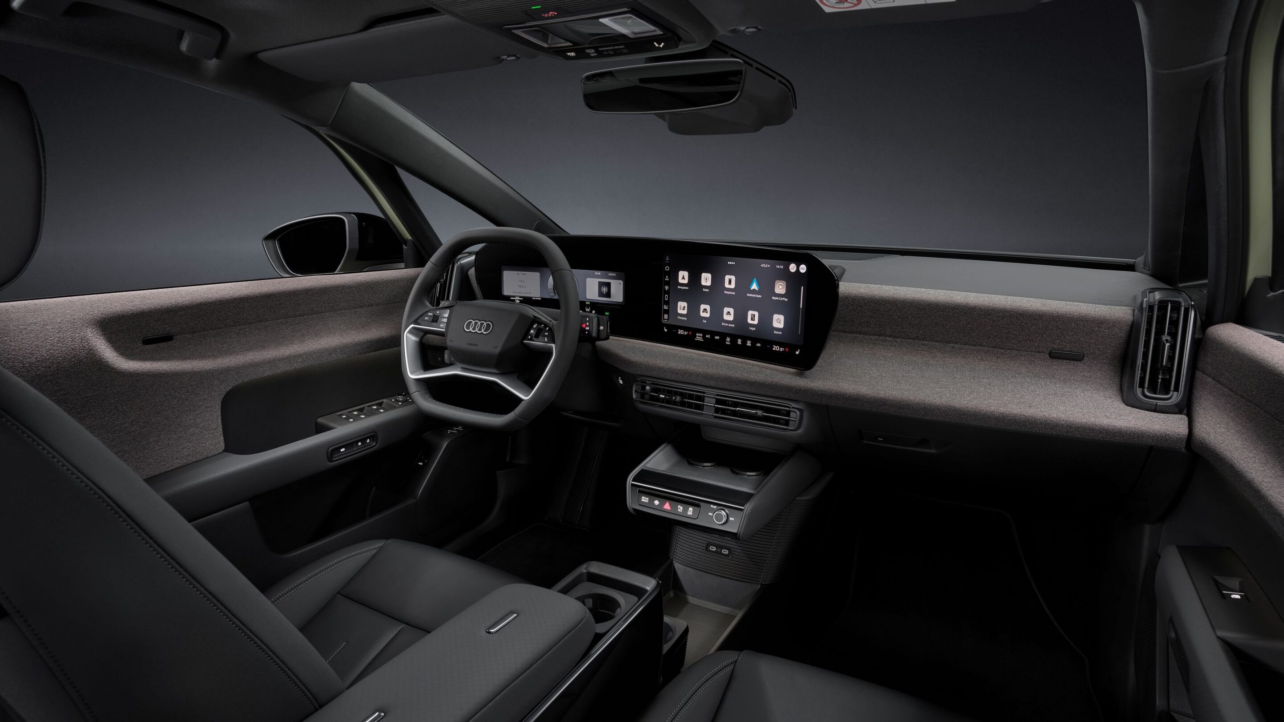 Audi A2 e-tron cabin with curved MMI panoramic display, fabric-wrapped dashboard, and multifunction steering wheel