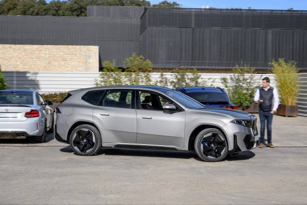 BMW iX3 50 xDrive parked outdoors during a media demonstration