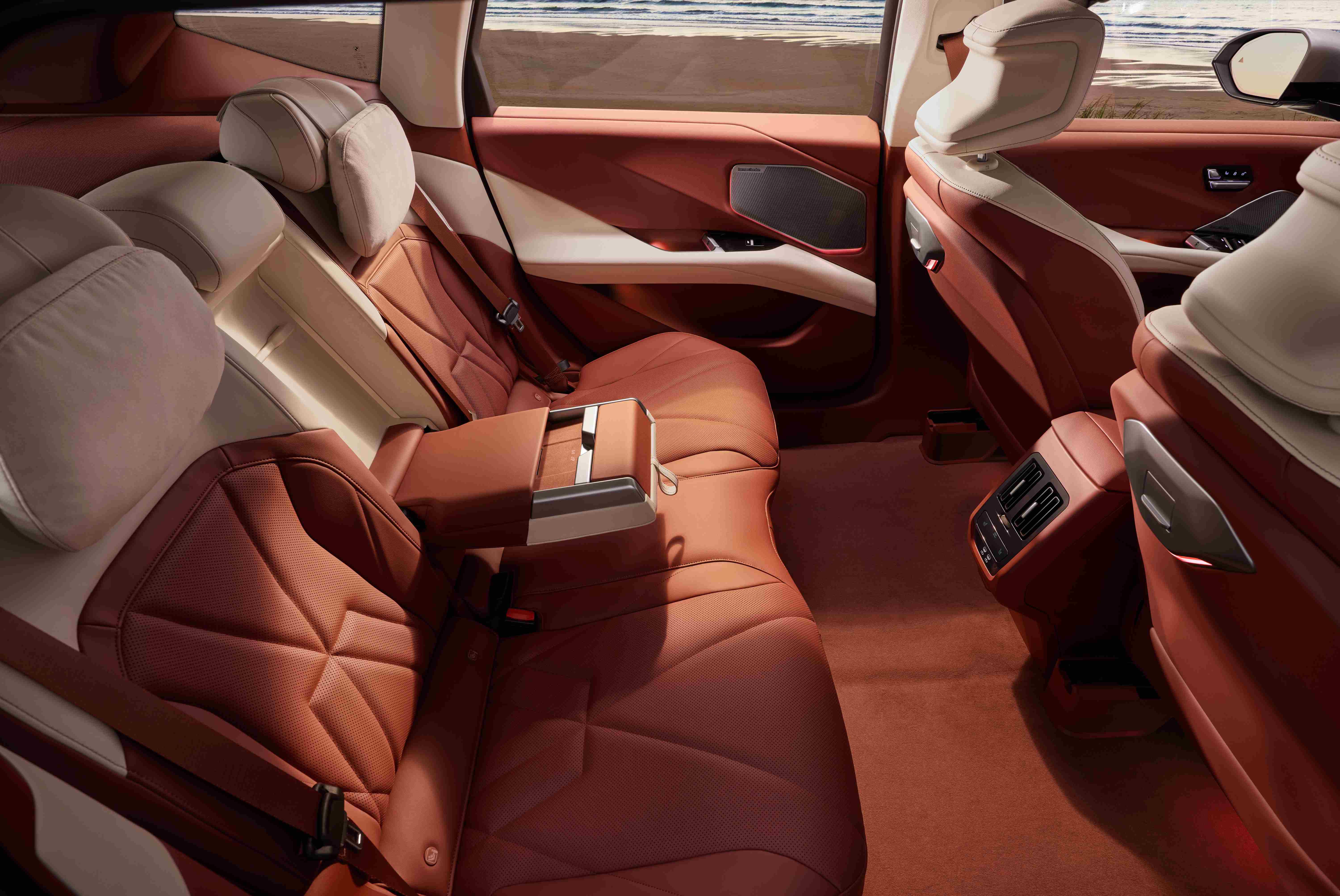 Interior of a BMW iX3 showing eco-friendly fabric upholstery and cabin trim