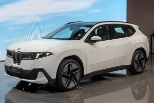 Grey BMW iX3 Neue Klasse battery SUV on the IAA 2025 stand, front three-quarter view