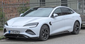 White BYD Seal electric sedan parked on a Stuttgart street, front three-quarter view