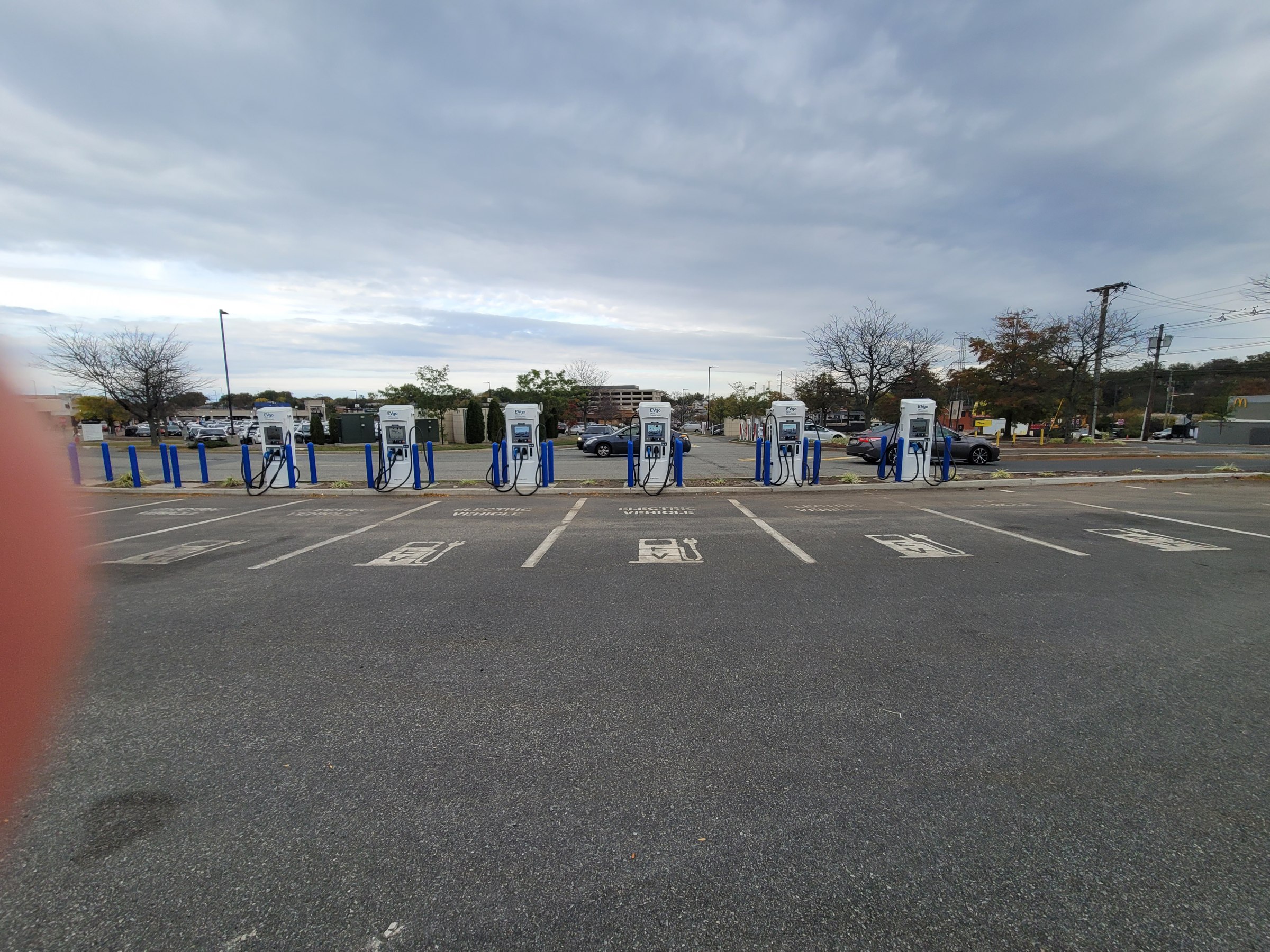 EVgo DC fast-charging stalls at Menlo Park Mall in New Jersey, one of Regency Centers grocery-anchored retail sites
