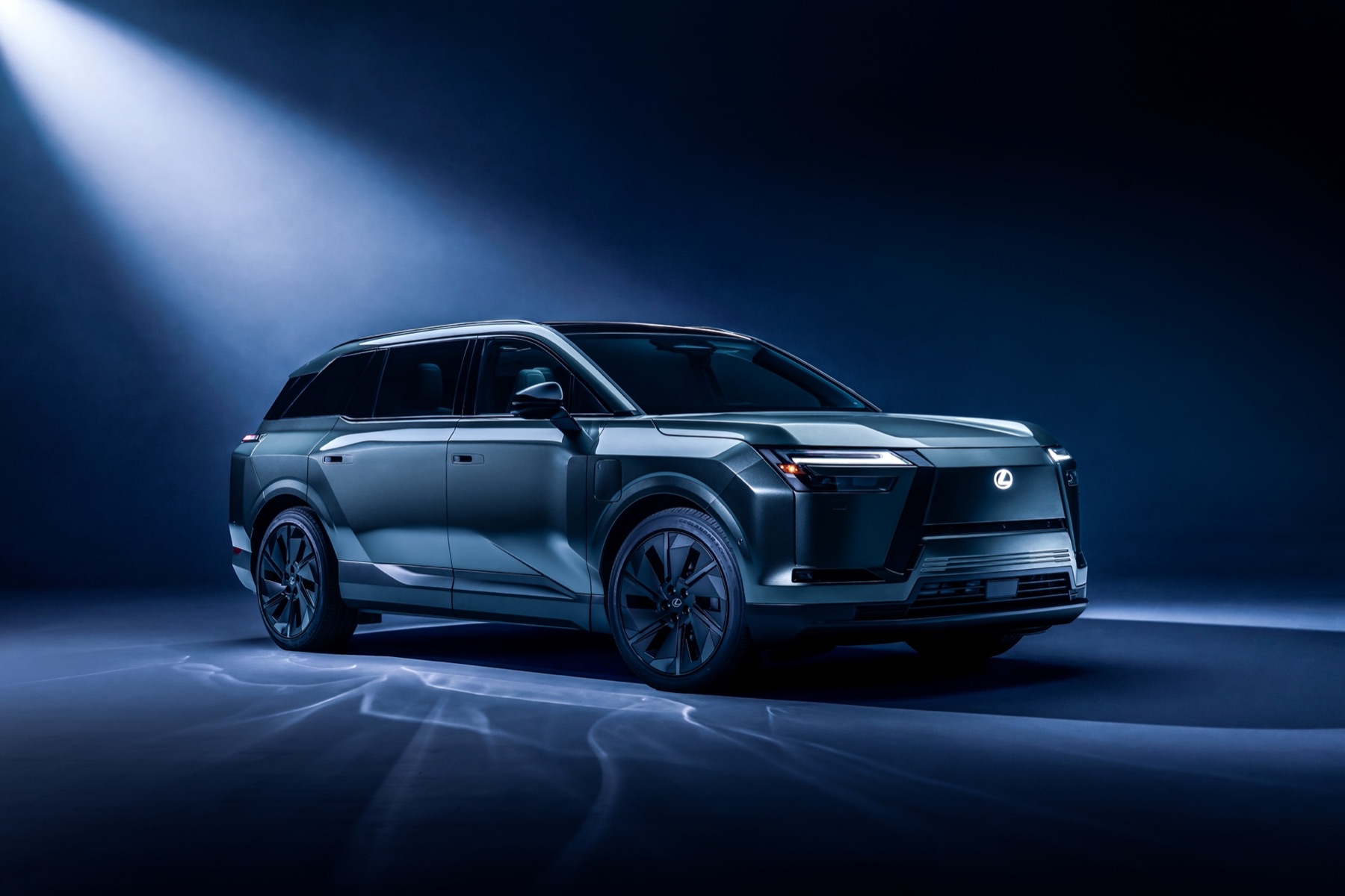 2027 Lexus TZ electric three-row SUV in a studio, front three-quarter view