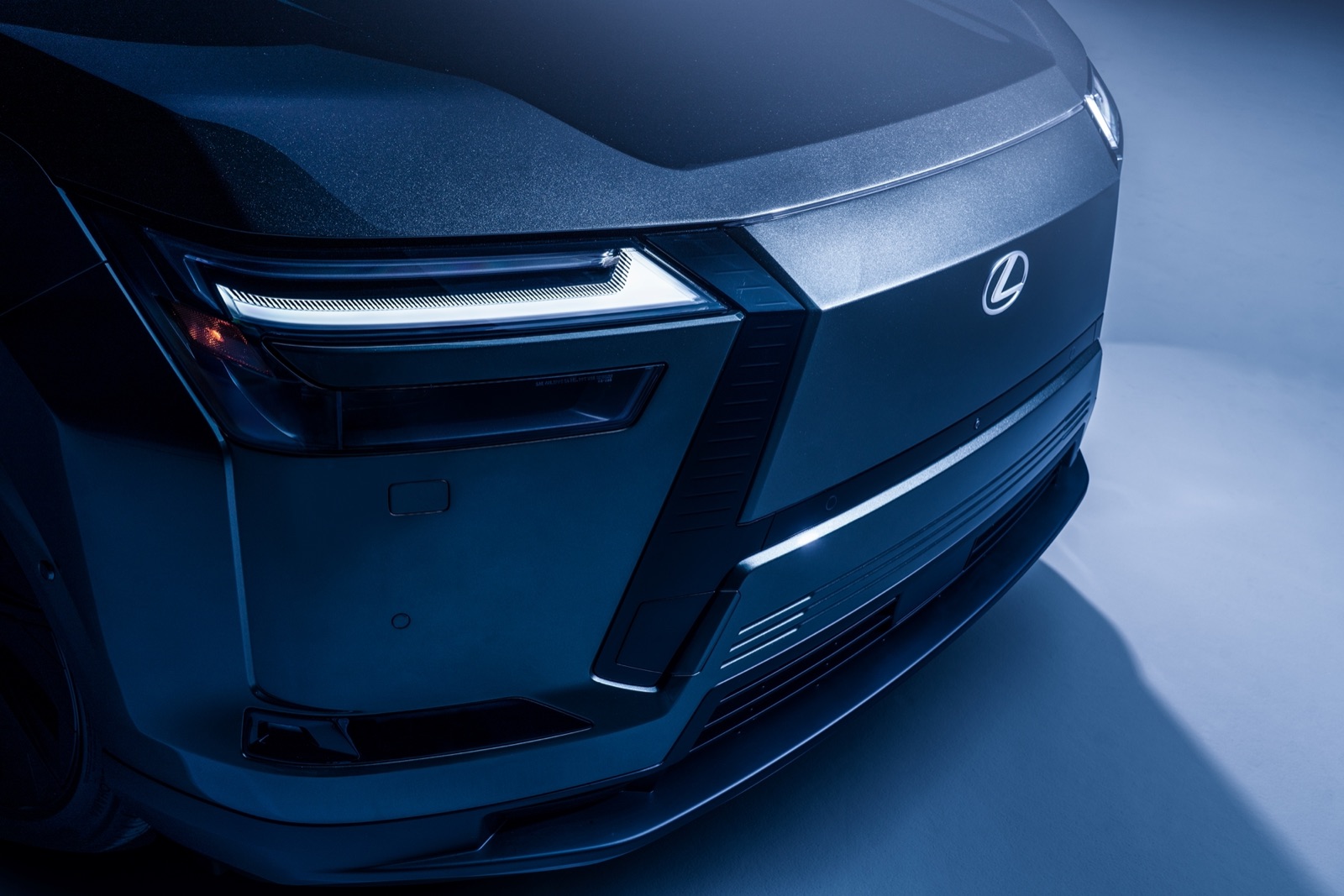 Close-up of the 2027 Lexus TZ front lamp and spindle-style face