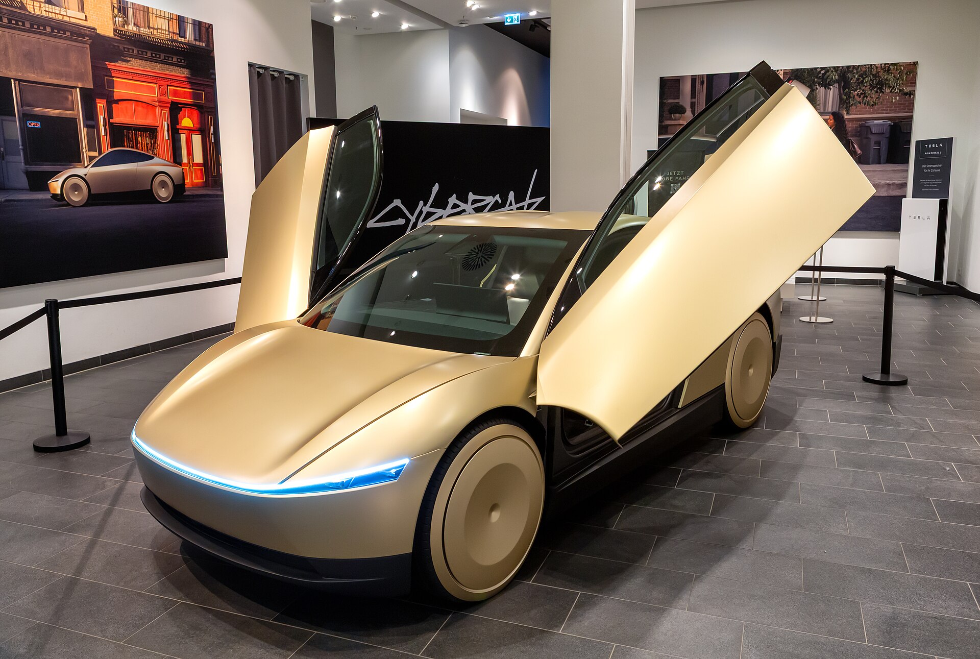 Gold Tesla Cybercab two-seat robotaxi on display at the Mall of Berlin in 2024