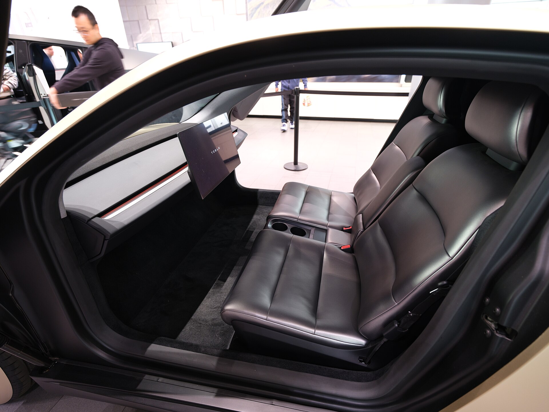 Concept Tesla Cybercab interior with no conventional steering wheel, photographed at Santana Row