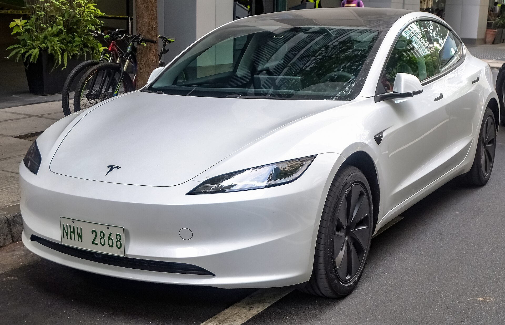 Pearl White Tesla Model 3 Highland rear-wheel-drive battery-electric sedan
