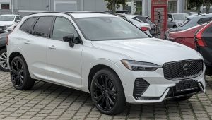 White 2026 Volvo XC60 SUV on a Stuttgart street, front three-quarter view, current SPA generation
