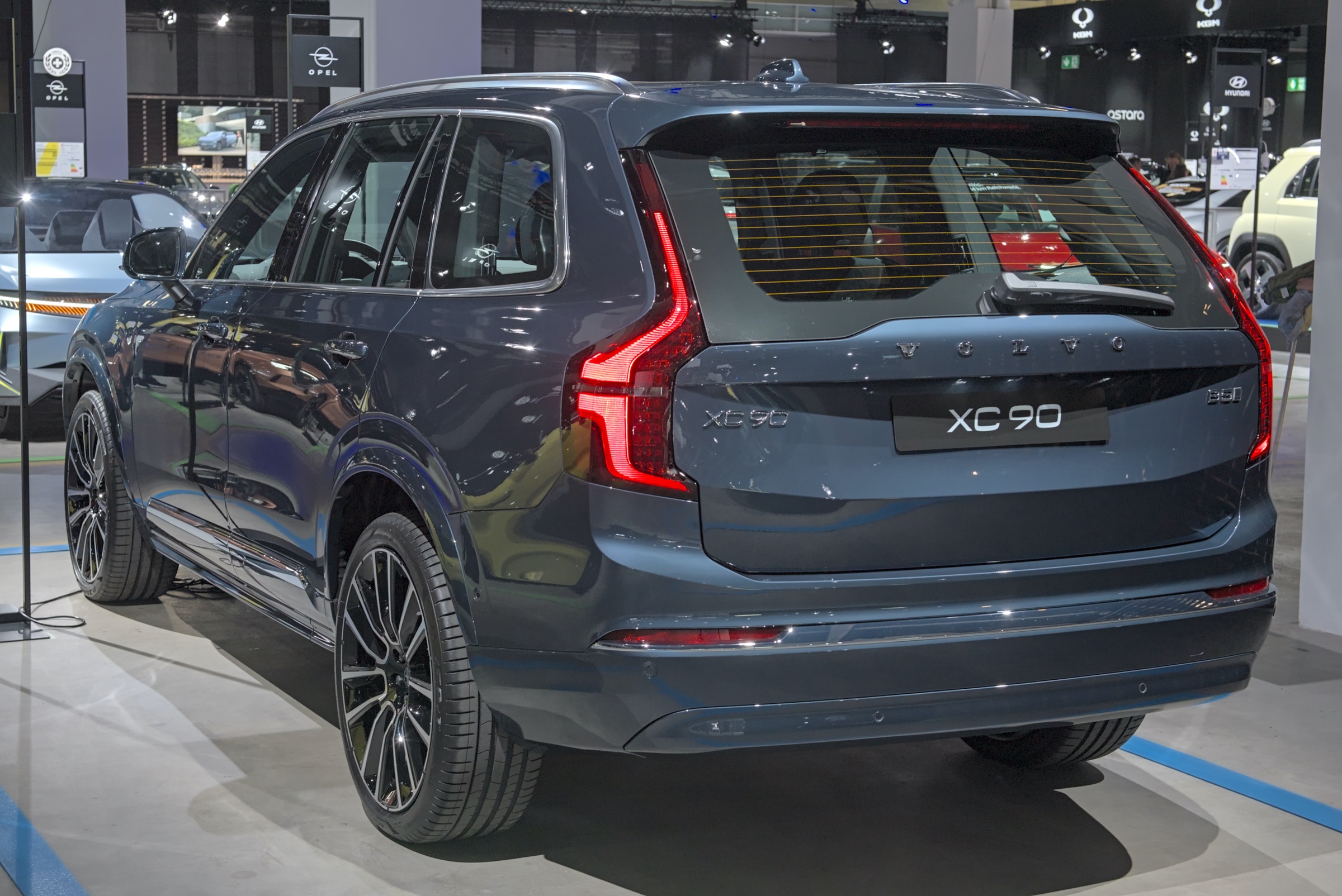 Dark 2025 Volvo XC90 at Auto Zürich 2024, front three-quarter view of the large three-row SUV