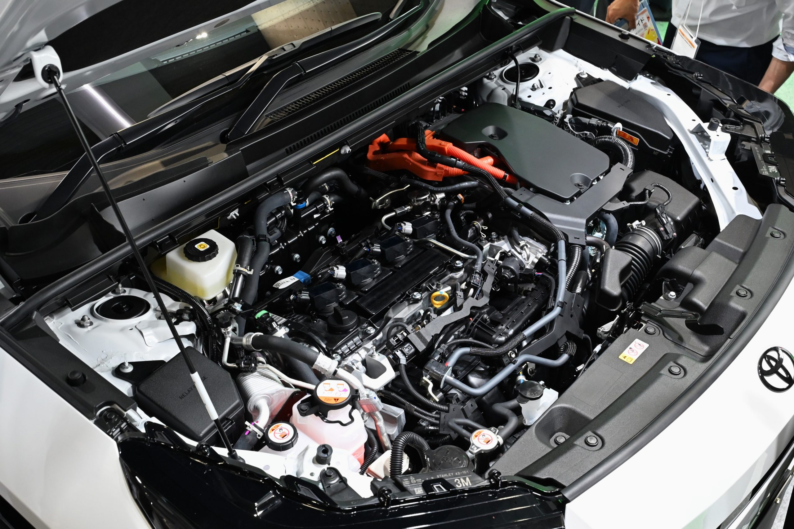 Engine bay of a 2026 Toyota RAV4 plug-in hybrid, showing the petrol engine and electric motor