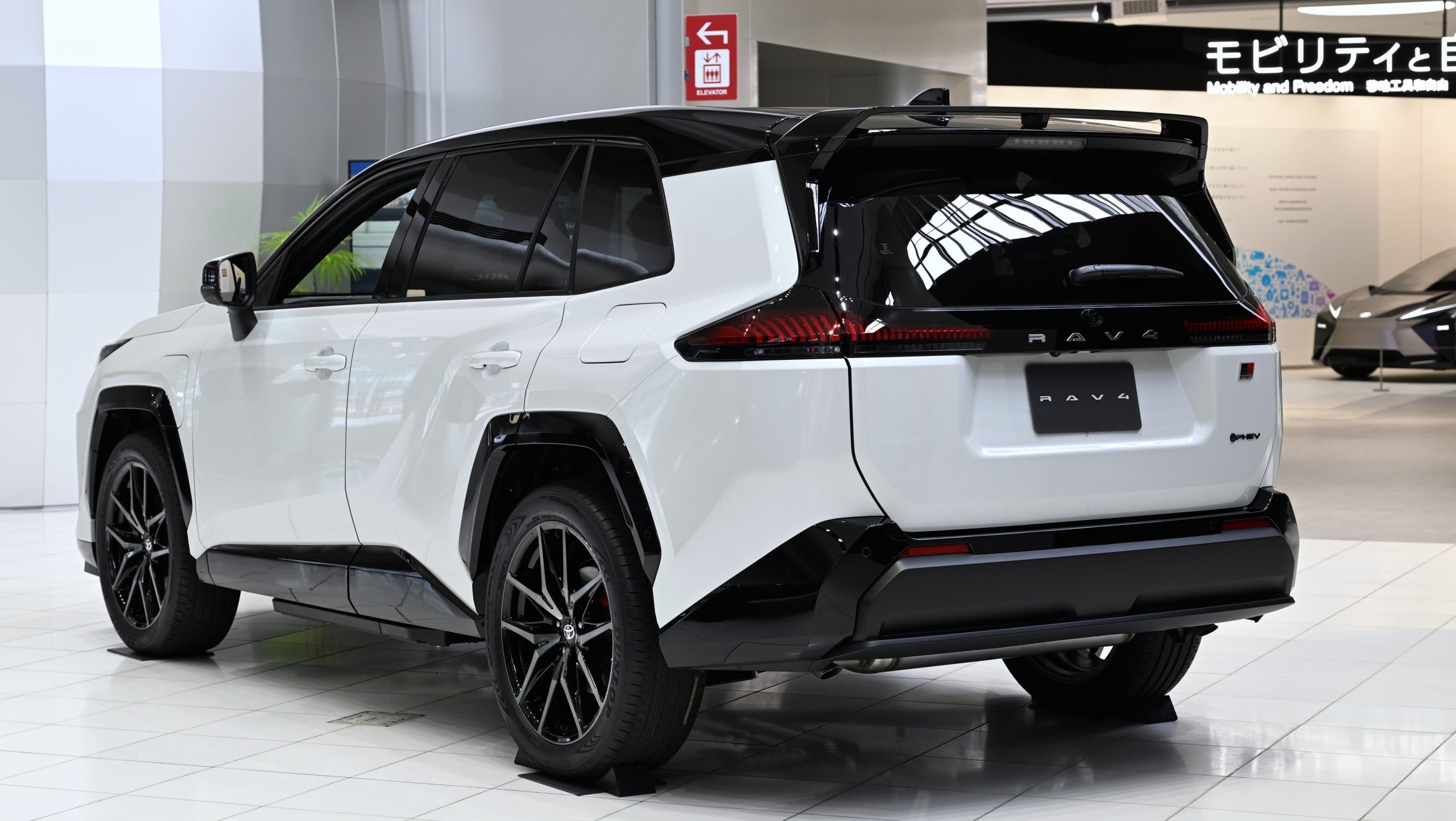 Rear three-quarter view of a 2026 Toyota RAV4 plug-in hybrid GR Sport prototype