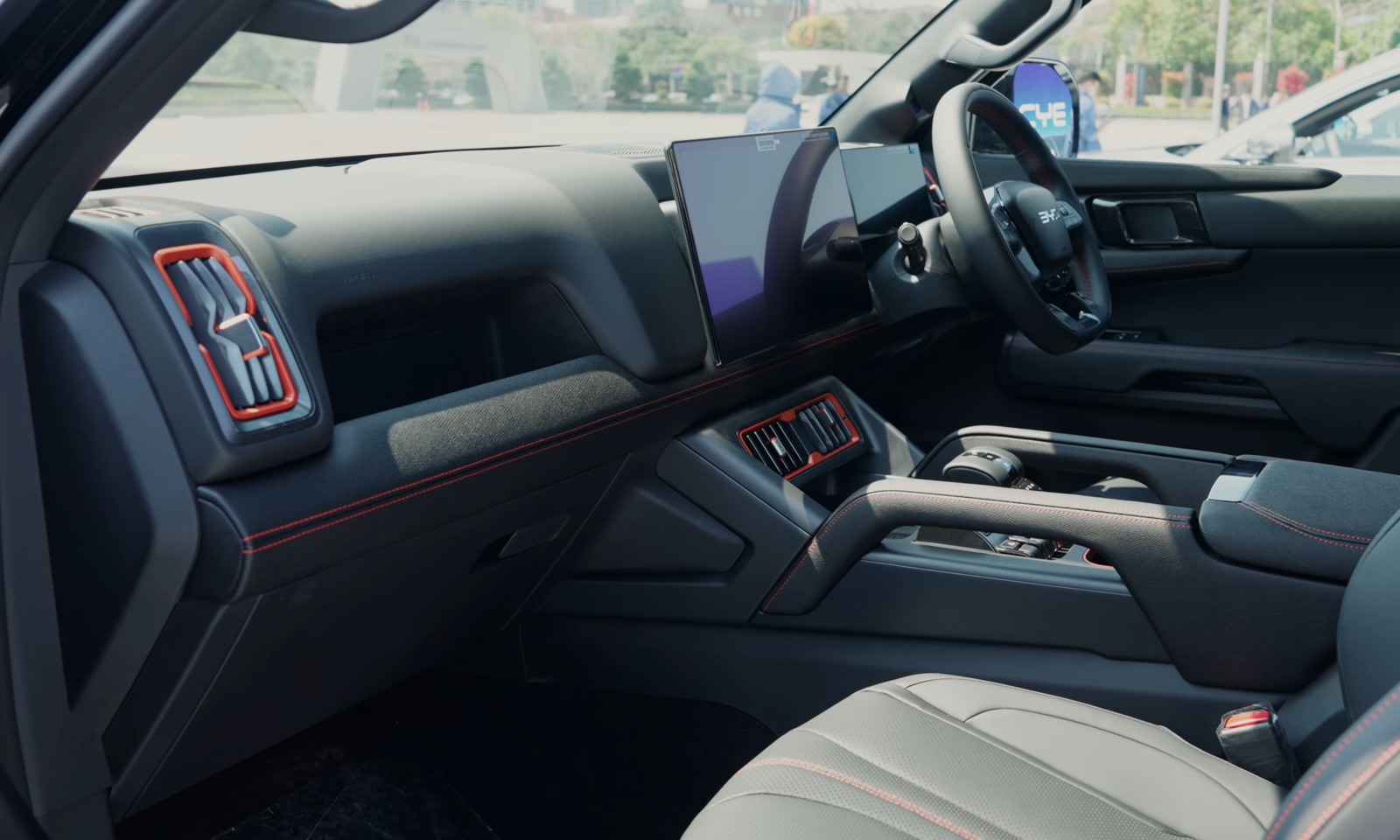Dashboard and front seats inside a BYD Shark 6 plug-in hybrid pickup