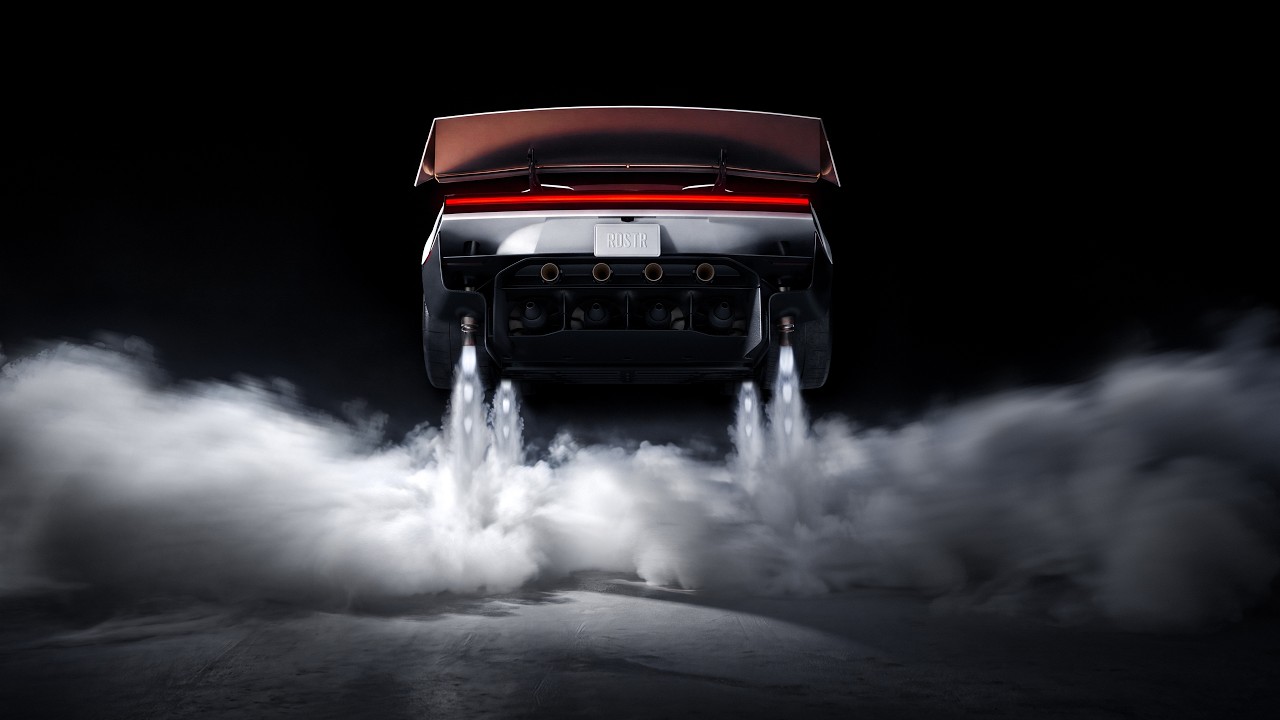 Rear view of a Tesla Roadster with the wing raised and four cold-gas plumes under the bumper