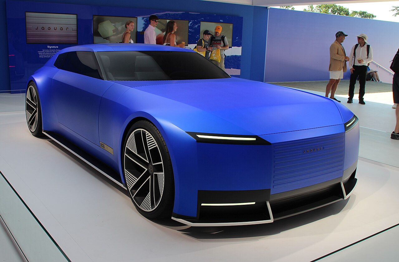 Blue Jaguar Type 00 concept showing its flat bonnet, slim light bars and upright grille panel