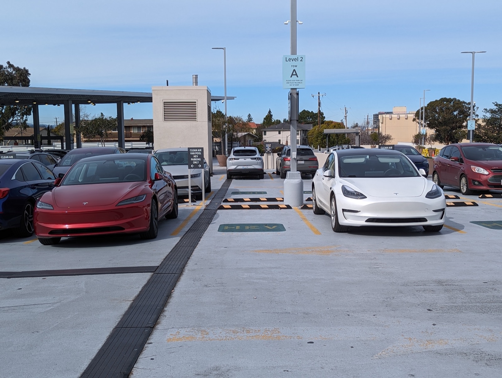 Front three-quarter view of a 2024 Tesla Model 3 Highland sedan