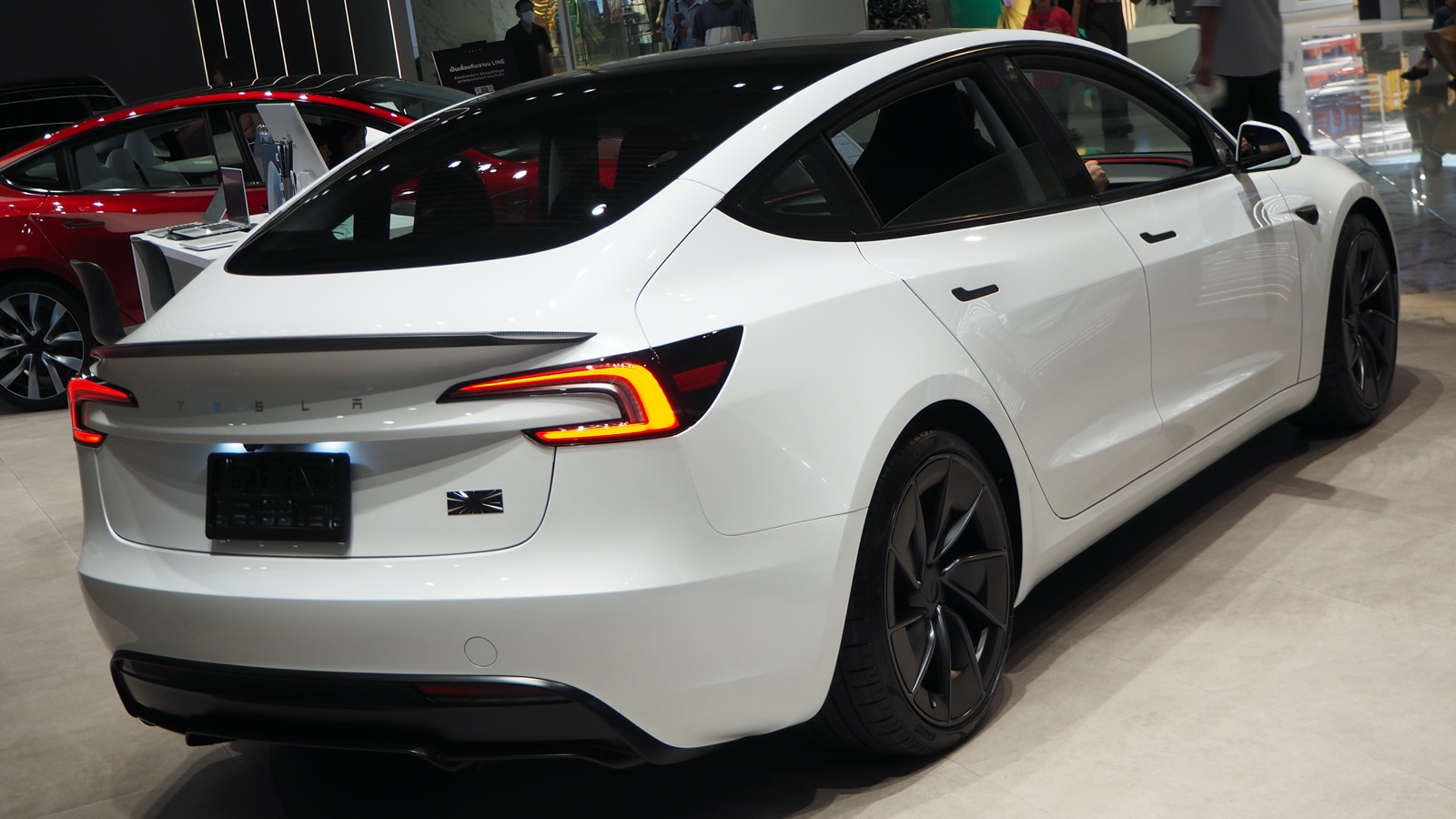 Rear view of a 2024 Tesla Model 3 Highland Performance sedan