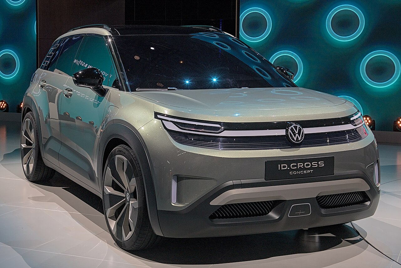 Volkswagen ID. Cross concept at IAA 2025, front three-quarter view, light-bar headlights on, plate reading ID.CROSS CONCEPT