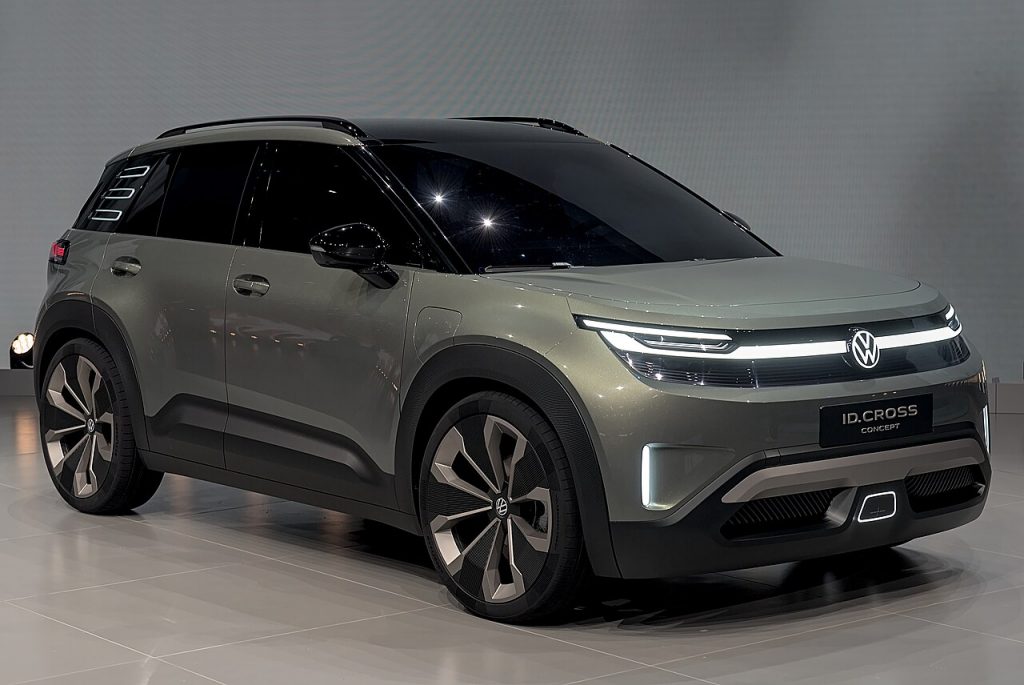 Olive-green Volkswagen ID. Cross concept SUV in a studio, front three-quarter view, plate reading ID.CROSS CONCEPT