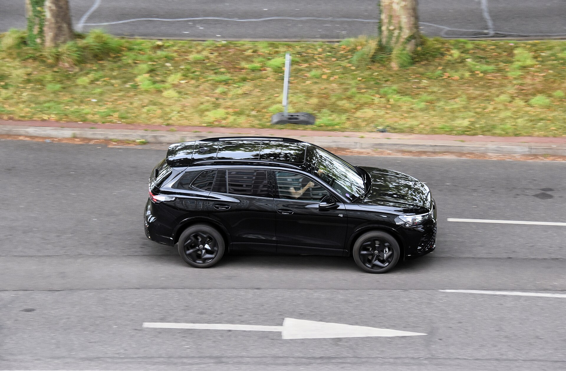 Black Volkswagen Tiguan 1.5 eHybrid R-Line plug-in hybrid SUV in side profile